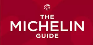 Red background with white text of The Michelin Guide